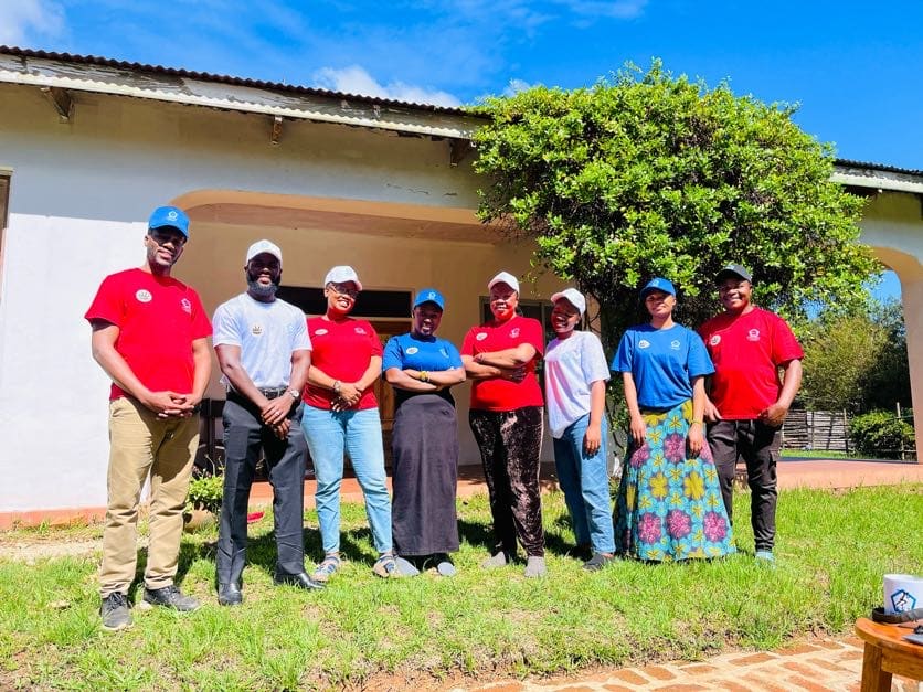 Every Child Tanzania volunteers pose together on lawn for photo.